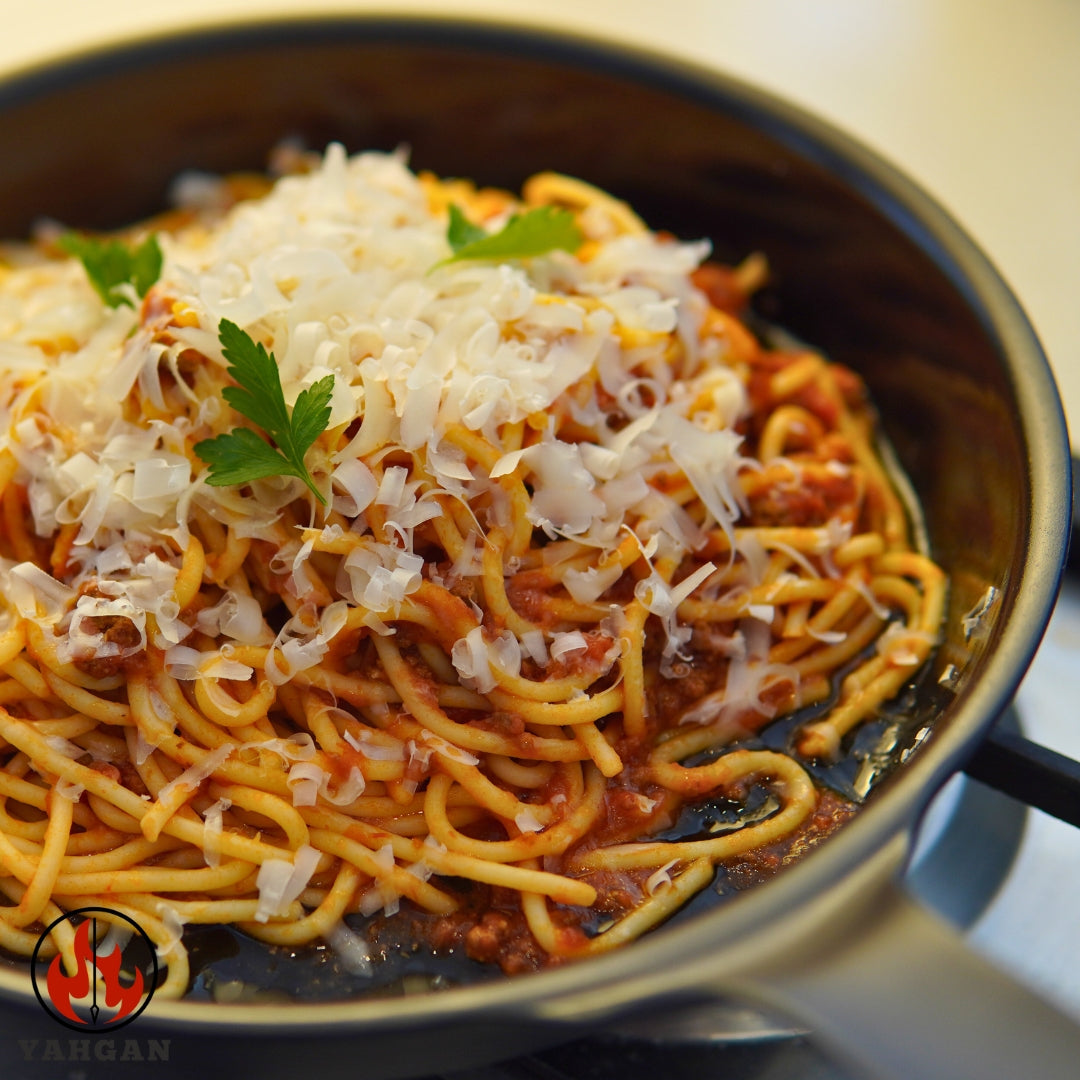 Pasta dish cooking in Yahgan Black Series carbon steel pan — naturally non-stick seasoned surface