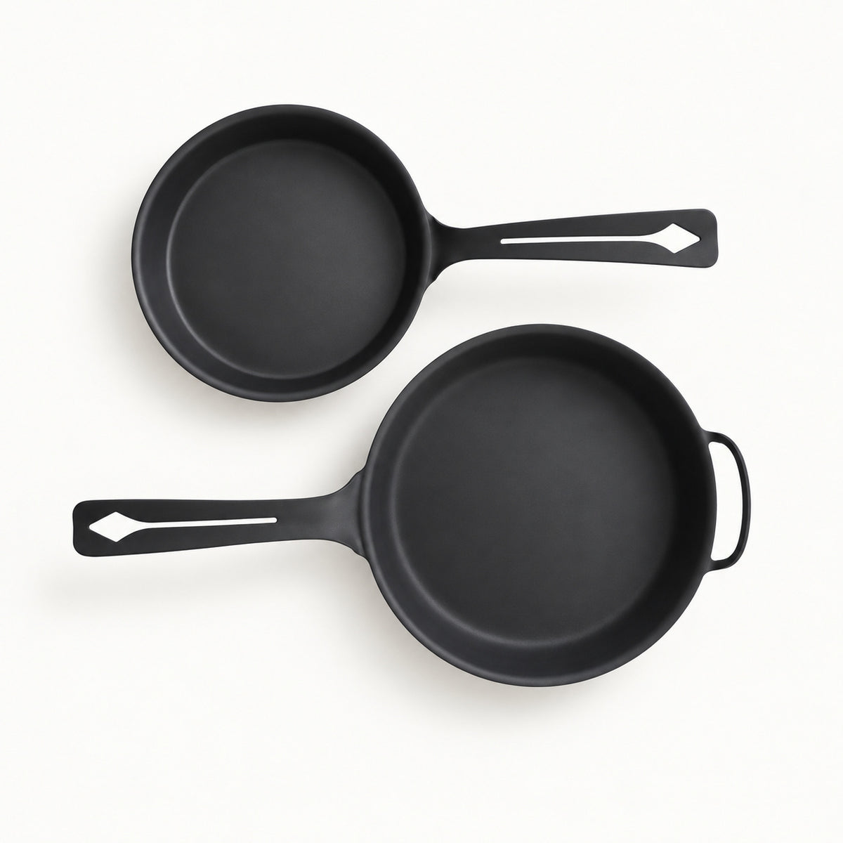 Yahgan Black Series 30cm and 26cm carbon steel pans side by side showing the size difference