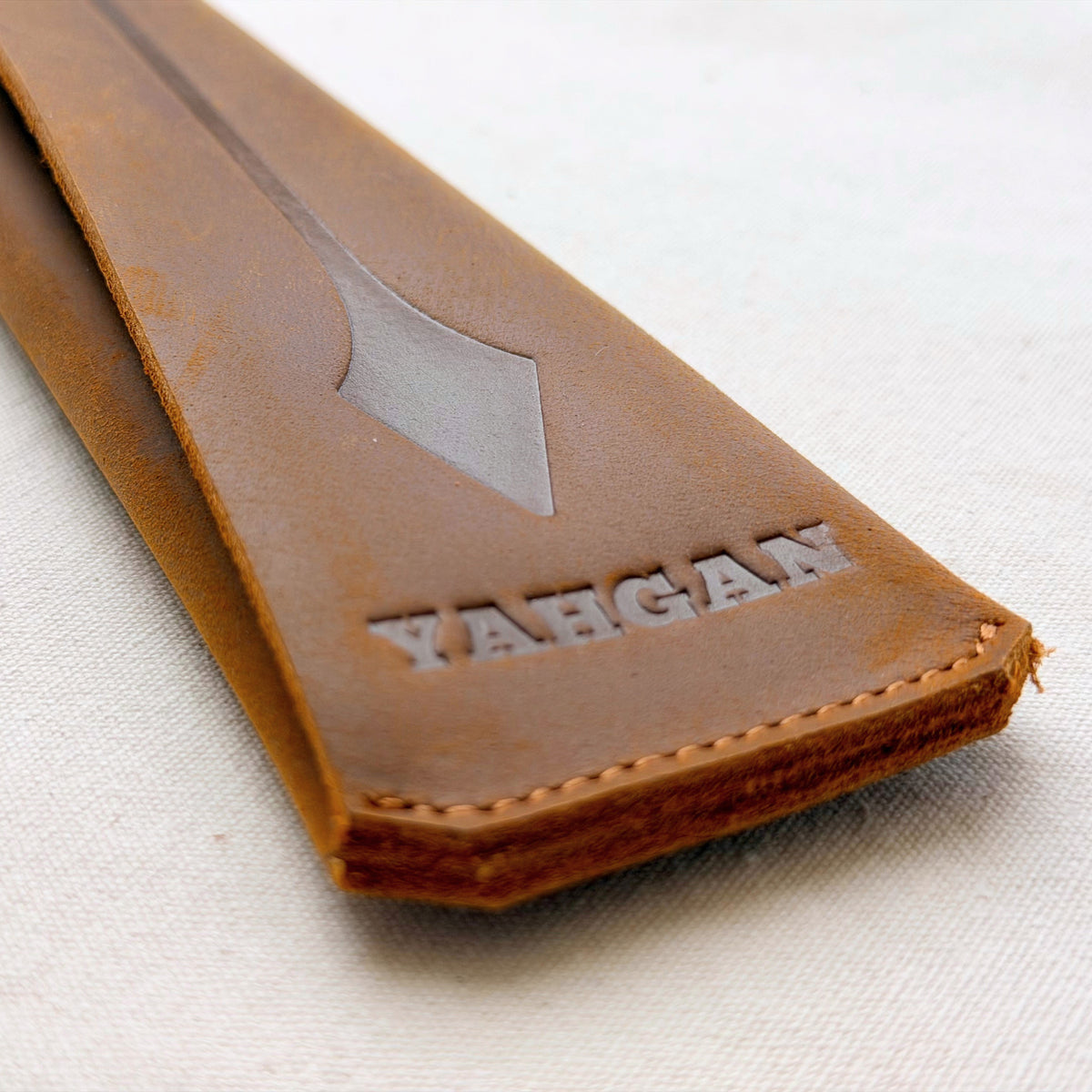 Yahgan natural leather handle sleeve, embossed, fits both the 30cm and 26cm pans