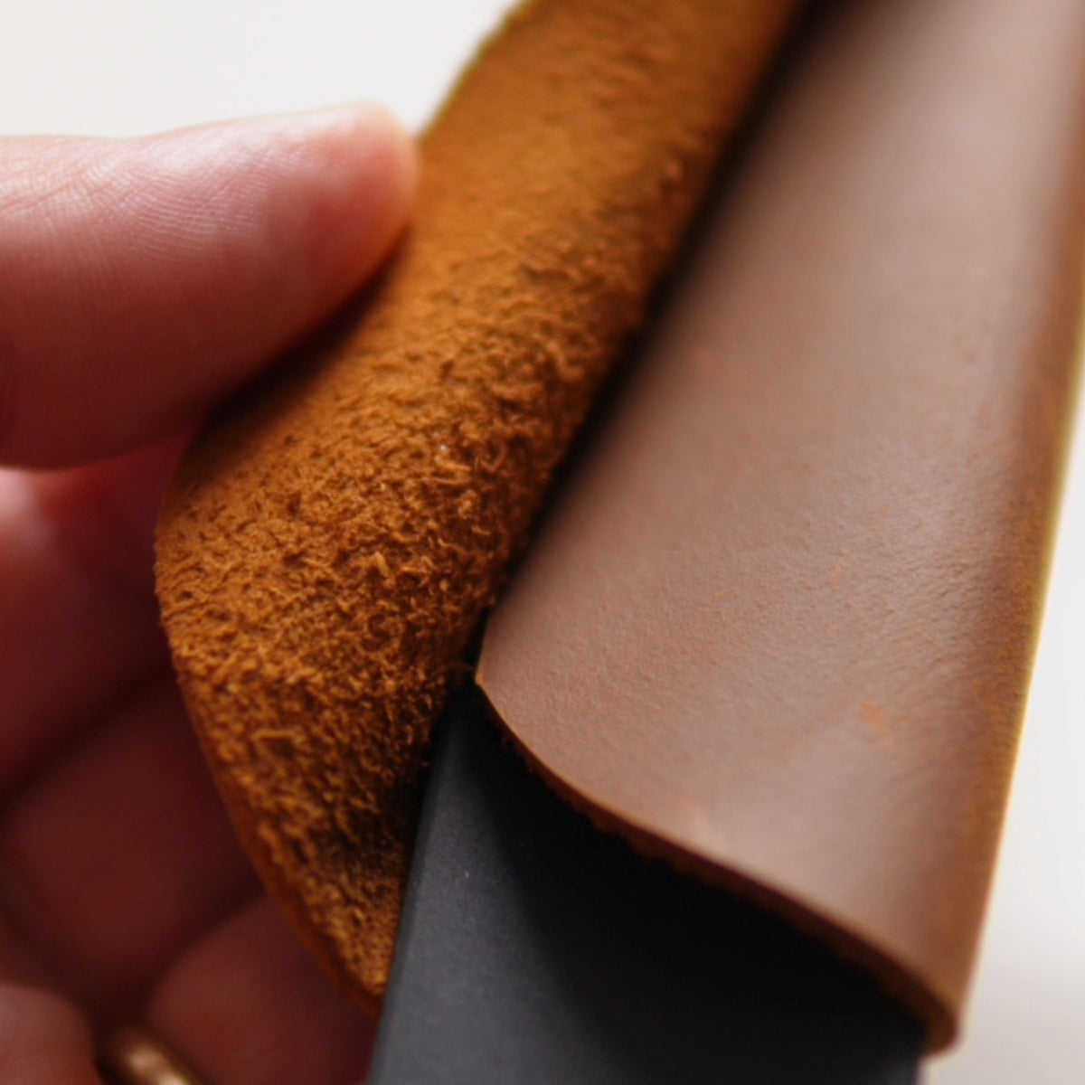 Close-up of the natural leather grain on a Yahgan handle sleeve