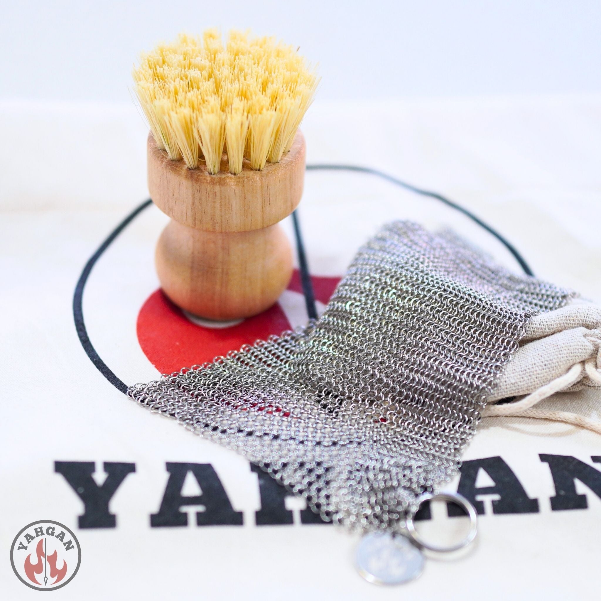 Yahgan Care Kit — 316L stainless steel chainmail scrubber and beechwood sisal brush on branded Yahgan cotton bag