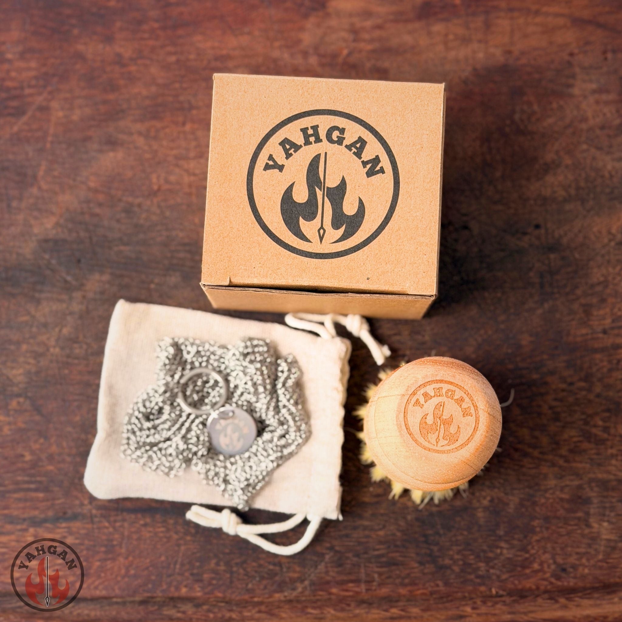 Yahgan Care Kit unboxed — beechwood sisal brush and natural cotton drawstring bag with 316L chainmail scrubber inside branded box