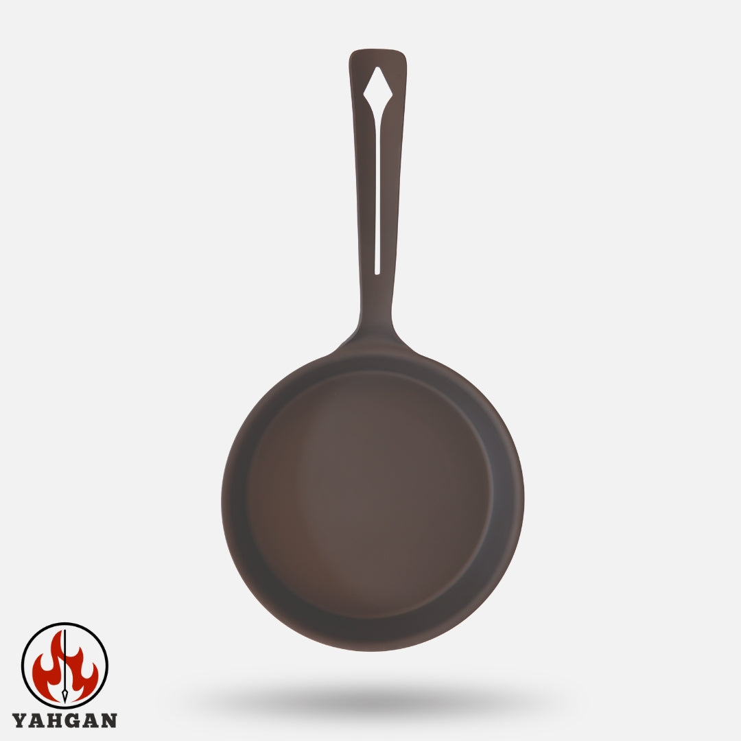 Top-down view of Yahgan Classic Series 26cm raw carbon steel pan — one-piece forged from ST12 carbon steel